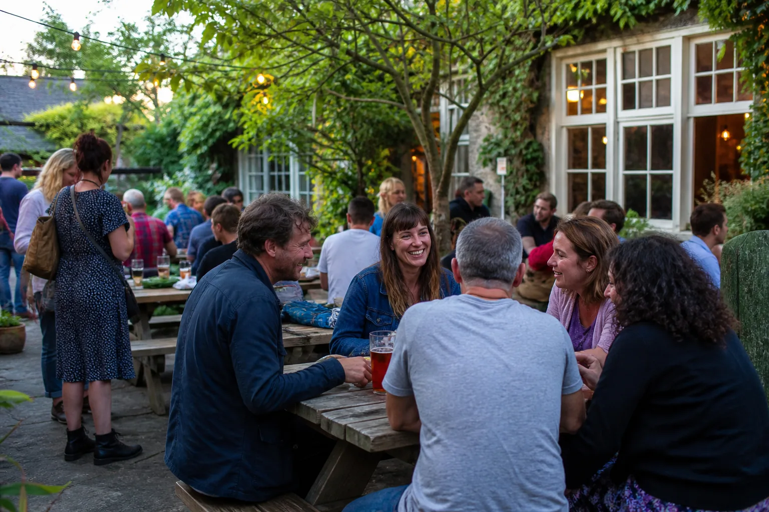 People talking at an outdoor community event in Stroud
